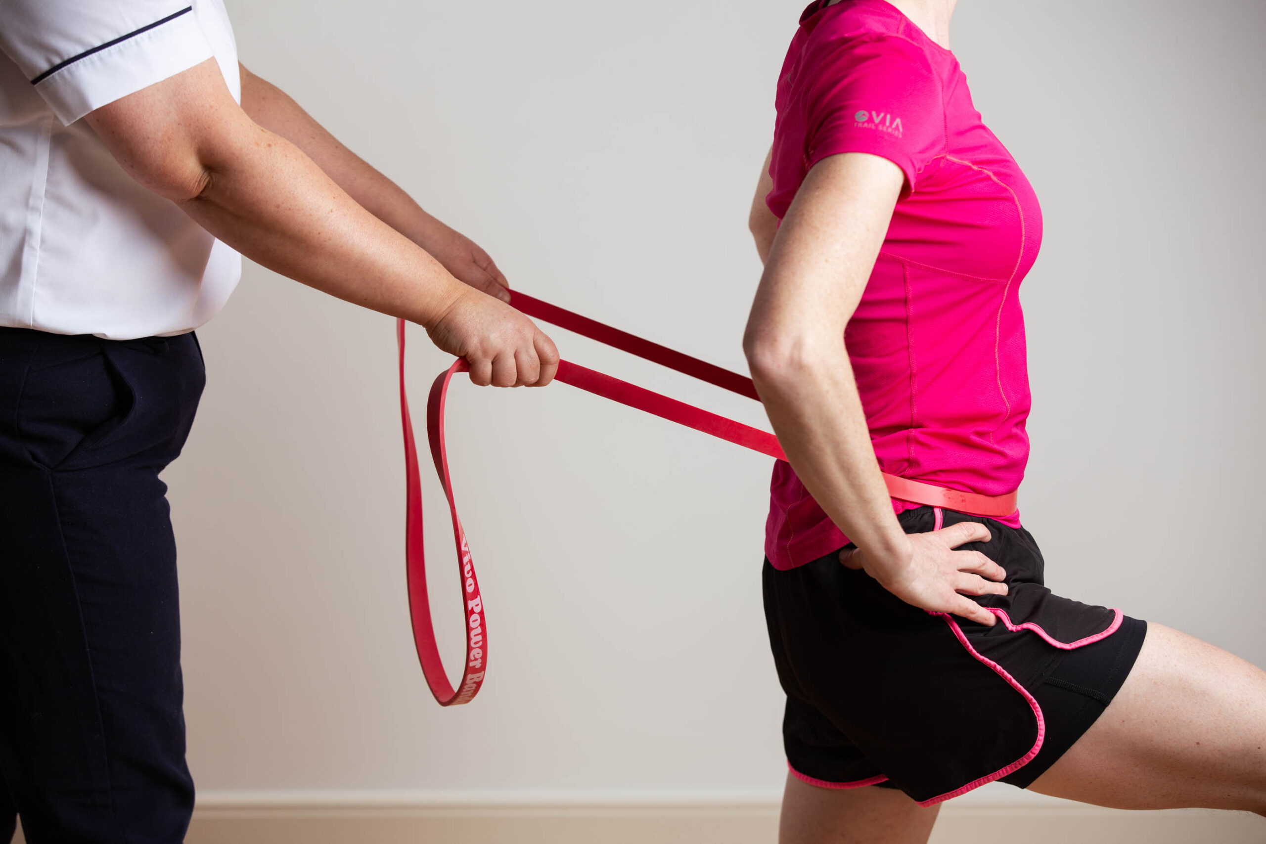 Woman Pulled with Resistance Bands Physiotherapy